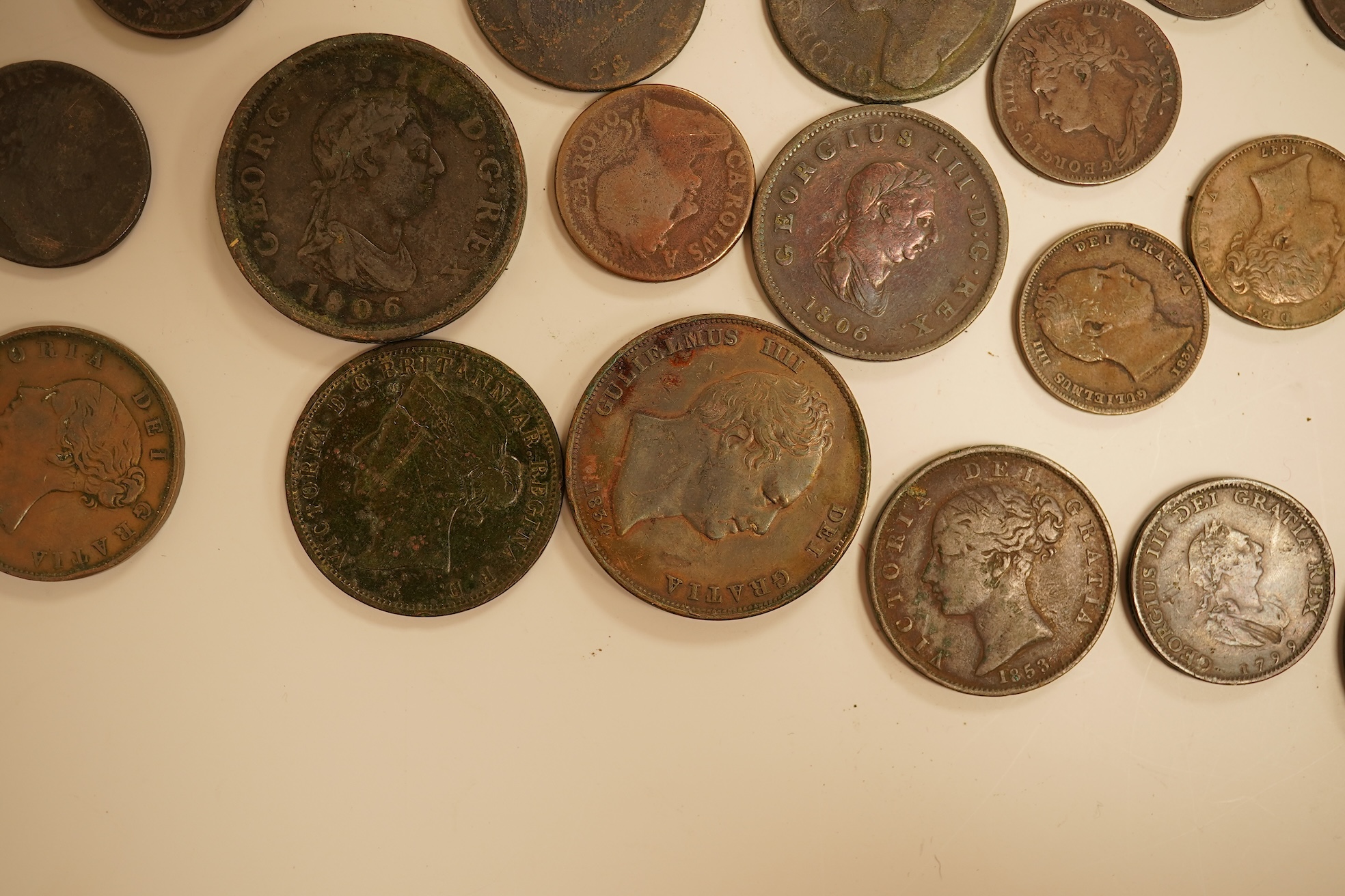 Twenty three copper coins including a William IV penny
